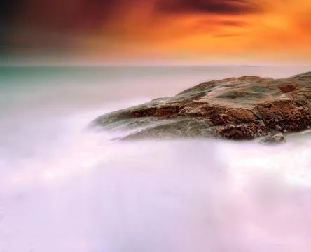 Rocks in the sea in sunset Stock Illustration