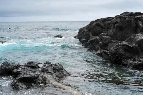 Rocks sea waves Stock Photos