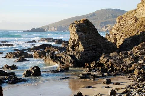 Rocks on the seashore on the beach Stock Photos