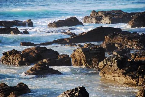 Rocks on the seashore on the beach Stock Photos