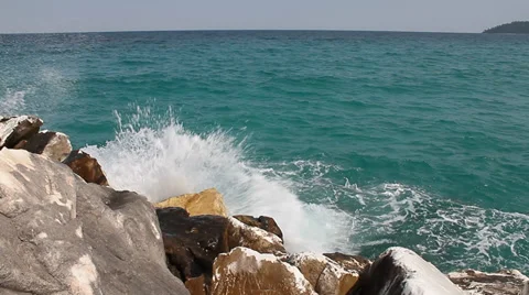 Rocks at seashore splashed by waves Video stock 30712069