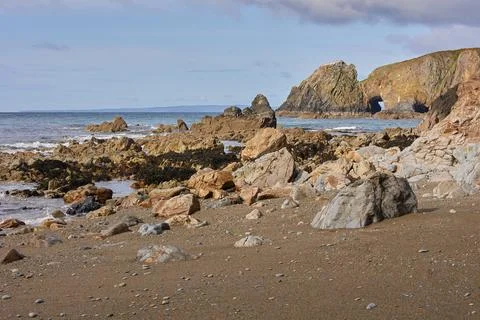 Rocks seen leaving the low tide of Kilfarrasy Beach. Co.Waterford Coastline Stock Photos