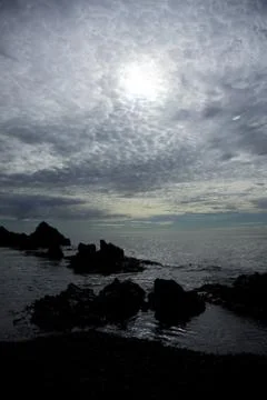 Rocks silhouetted on Dritvik beach Stock Photos