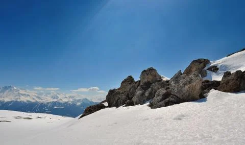 Rocks on the snow in mountain Stock Photos