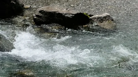Rocks in the stream of a brook in the German alps Stock Footage 78153769