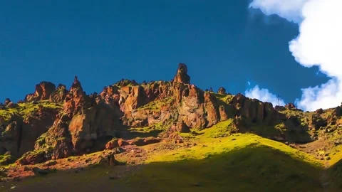 Rocks in the sunlight. The movement of clouds across the sky over the mountains. Stock Footage 158859365