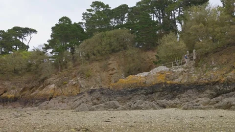 Rocks with trees, sandy beach and Corbière Bay at low tide in Saint-Malo. Stock Footage 308192444