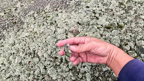 Rocks of various sizes on the edge of a volcanic crater. Stock Footage 313006696
