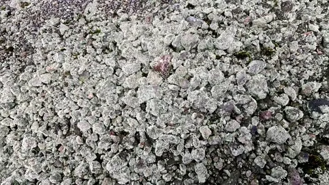 Rocks of various sizes on the edge of a volcanic crater. Stock Footage 313006740