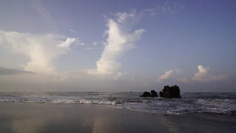 Rocks washed by ocean waves under the rays of the sun Stock-Footage 135649266