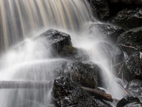 Rocks in waterfall closeup Stock Photos