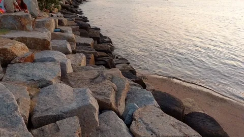 Rocks with waves and sky Stockbeeldmateriaal 297644074