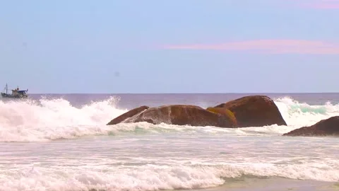 Rocks waves ship Lopes Mendes beach Ilha Grande island Brazil. Stock Footage 334988575