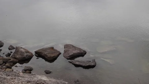 Rocks in Yellowstone Lake Stock Footage 154767425