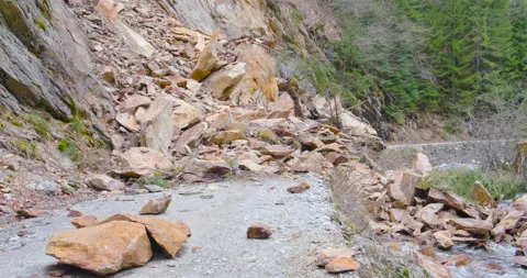 Rockslide over road and river Galbenul, in Romania. Landslide, natural disaster. Stock Footage 153085457