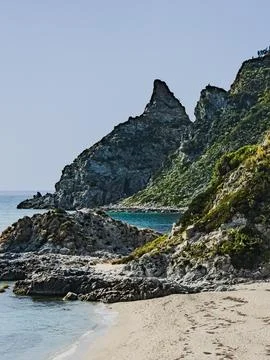 Rocky beach and cliffs in Capo Vaticano Italy Stock Photos