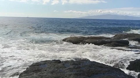 Rocky beach and waves Stock Footage 82574452