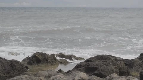 Rocky beach in a cloudy day Stock Footage 138776709