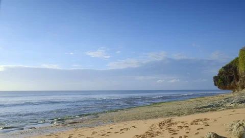 Rocky beach during low tide waves with sea floor covered by seaweed Video stock 114818939