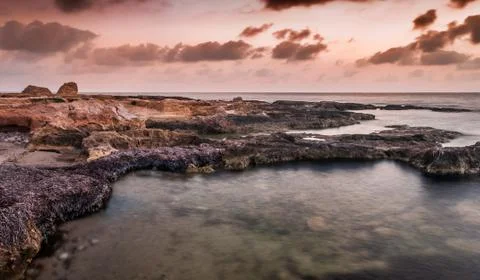 Rocky beach at morgning Stock Photos