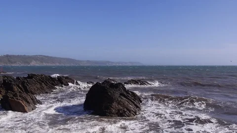Rocky beach, small powerful waves at high tide Stock Footage 81234340