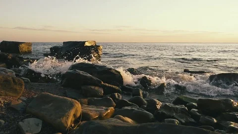 Rocky beach at sunset and clear sky slow mo Stock-Footage 81441191
