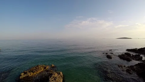 Rocky beach at sunset Stock Footage 89323467