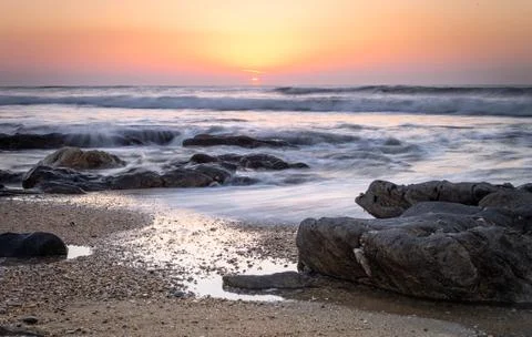 Rocky Beach at Sunset Stock Photos