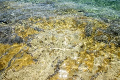 Rocky beach surface Stock Photos