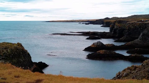 A rocky beach with volcanic basalt formations in West Iceland Stock Footage 119791387