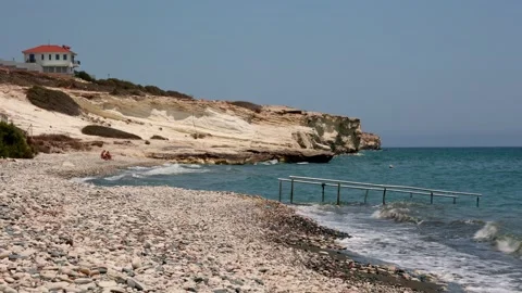 Rocky Beach with White Cliffs and Blue Sea in Cyprus Stock Footage 311427991