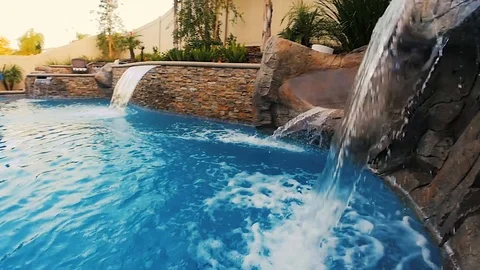 Rocky Blue Waterfall Into Pool Stock Footage 116471464