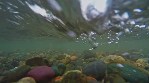 The rocky bottom of a mountain river with a fast current and clear water. Stock-Footage 306017827