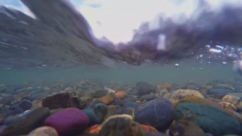 The rocky bottom of a mountain river with a fast current and clear water. Stock-Footage 306017841
