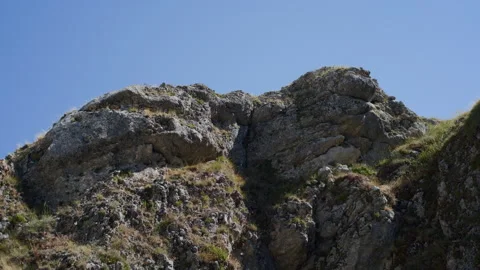 Rocky Canyon Wall in Shadow with Central Inset Stock Footage 315848876