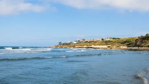 Rocky cape of Cabo de la Huerta district seen from San Juan beach in Alicante Stock Footage 154915550