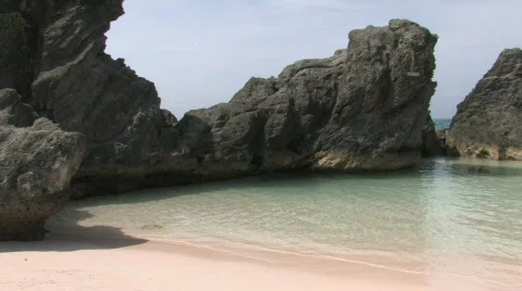 Rocky Caribbean Cliffs in Bermuda with Blue Water and White Sandy Beaches Stock Footage 463628