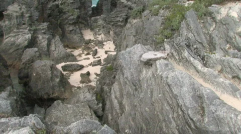 Rocky Caribbean Cliffs in Bermuda with Blue Water and White Sandy Beaches Stock Footage 463648