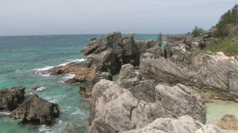 Rocky Caribbean Cliffs in Bermuda with Blue Water and White Sandy Beaches Stock Footage 463743