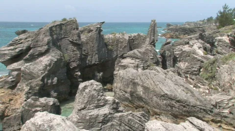 Rocky Caribbean Cliffs in Bermuda with Blue Water and White Sandy Beaches Stock Footage 464063