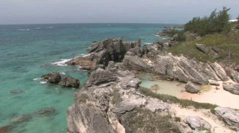 Rocky Caribbean Cliffs in Bermuda with Blue Water and White Sandy Beaches Stock Footage 464300