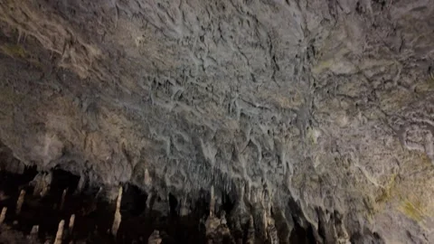 Rocky cave ceiling with small stalactites Stock Footage 344650798
