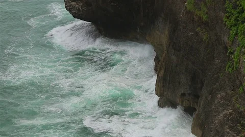 A rocky cliff and ocean waves Stock Footage 72446393