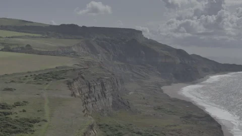 A rocky cliff overlooking a beach Stock Footage 298284721