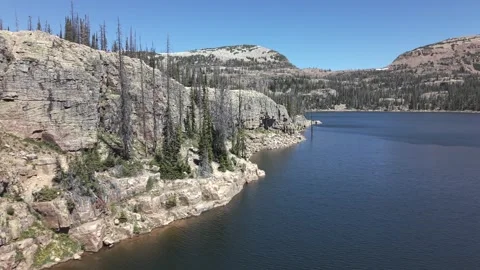 Rocky Cliffs Above Wall Lake in Uinta Mountains Utah Forward Push Stock Footage 336983275