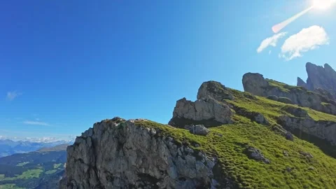 Rocky cliffs and grassy slopes of Seceda mountain in the Dolomites, Italy Видео 324637260