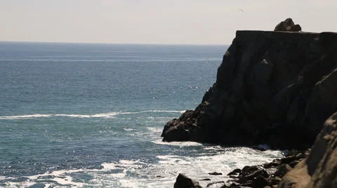 Rocky cliffs and Pacific Ocean during the day Video stock 66778205