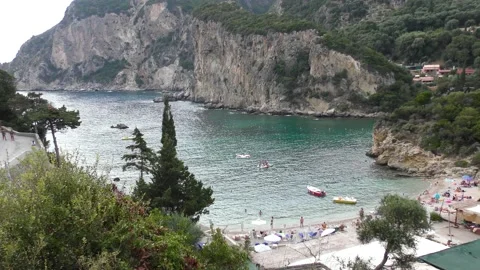 Rocky cliffs and small beach in Paleokastritsa area Corfu Stock Footage 132714860