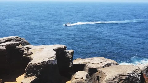Rocky Cliffs and Speedboat on Atlantic Coast, Berlengas, Portugal Stock Footage 320269360