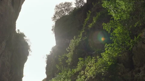 Rocky Cliffs Bathed in Morning Light Stock Footage 282937291